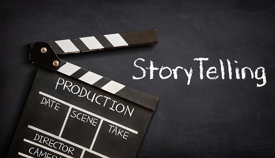 Storytelling. What Is Your Story. Movie clapper board on black background.