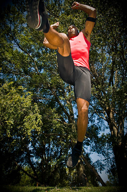 istock running athlete takes a jump 173567334