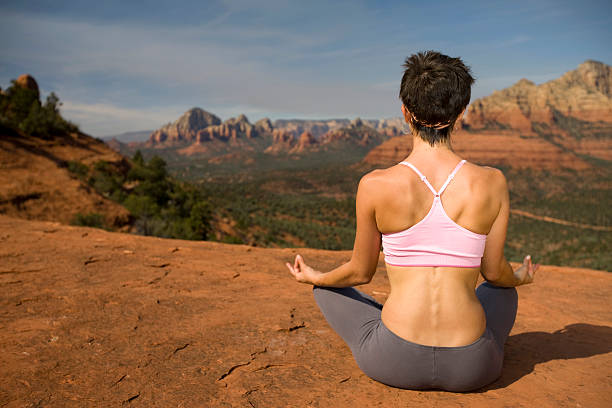istock Female meditating outdoors 173567648