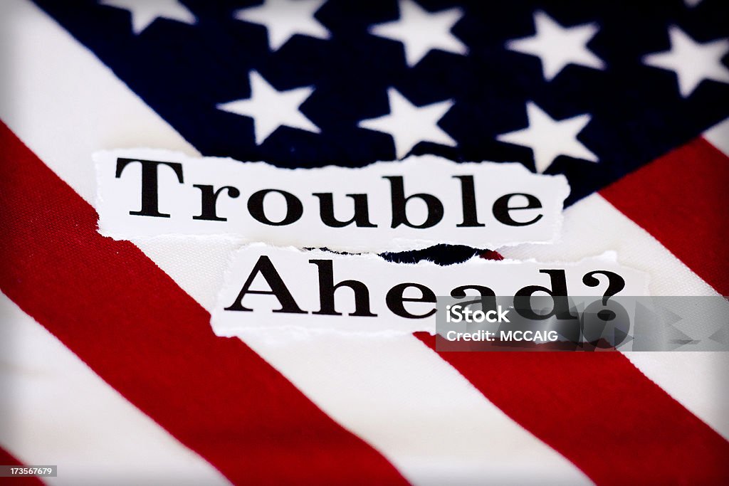 trouble ahead? An American flag with the words trouble ahead Government Stock Photo