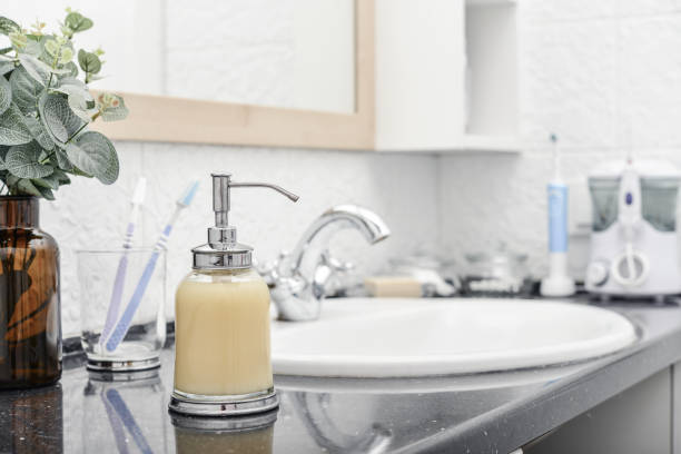 istock Bathroom set with glass liquid soap dispenser 1735685516