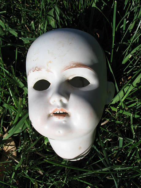 Antique Scary Doll Head stock photo