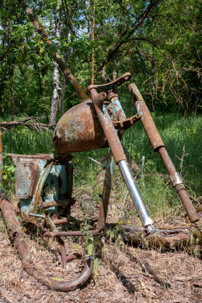 istock Rusty frame from a motorcycle in the exclusion zone of Belarus. 1735693157
