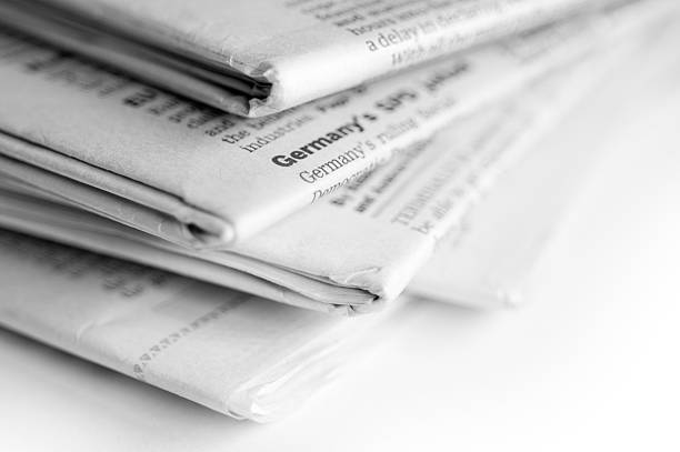 istock Close up image of newspapers stacked in a pile 173569328