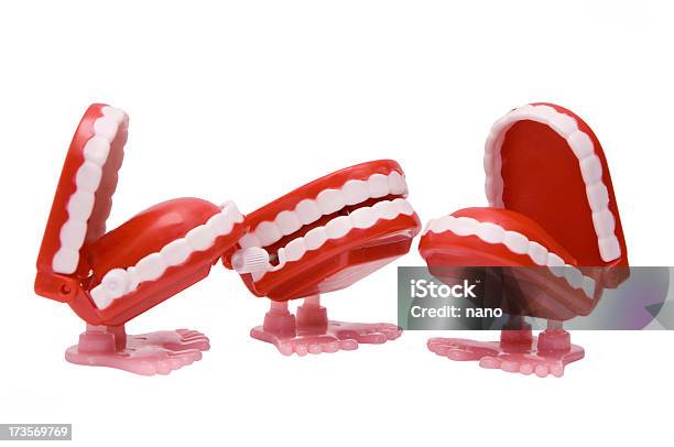 Three Windup Chattering Teeth Toys With Feet Stock Photo - Download Image Now - Cut Out, Dentures, Plastic