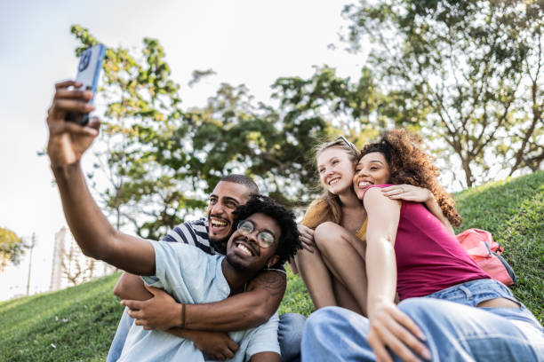 istock Student friends taking a selfie on the park 1735704598