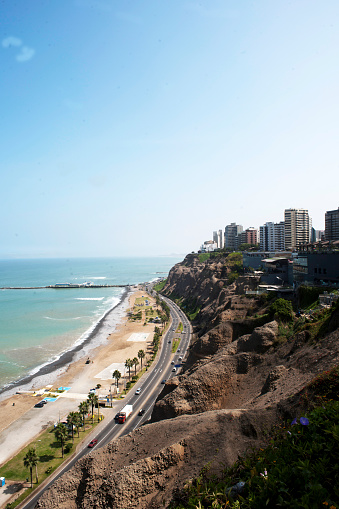 Peru Miraflores view of the /green coast/pacific ocean with beaches and a highway on a cliff