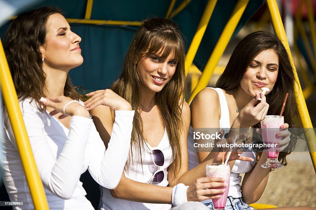 Friends with milkshakes "Friends with milkshakes, selective focus, canon 1Ds mark III" Adult Stock Photo