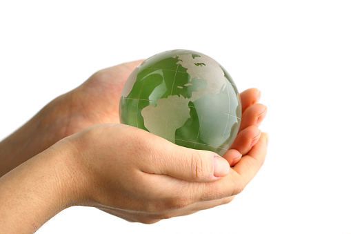 Green globe in the hand