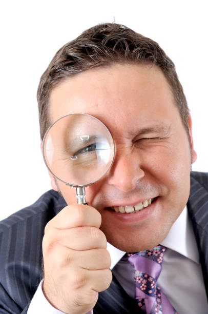 istock businessman's eye in the magnifying glass 173571162