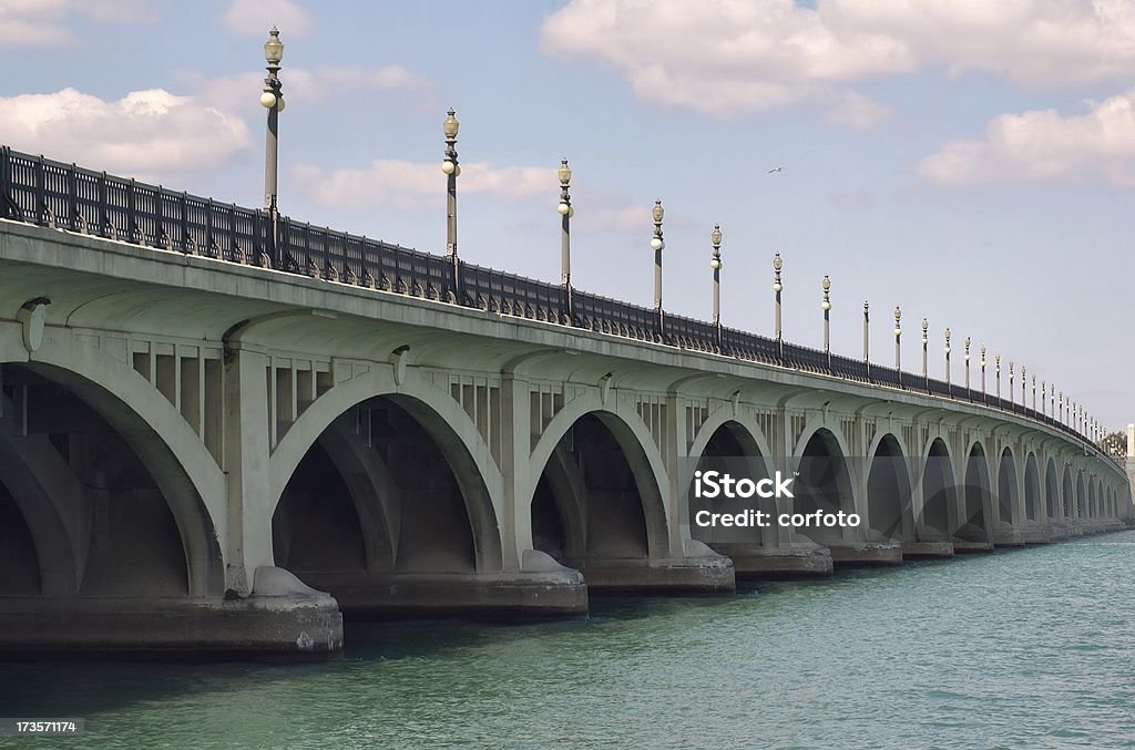 Belle Isle Bridge Belle Isle Bridge connects Detroit and Belle Isle, a favorite park and picnic spot for locals. The graceful structure spanning Detroit River was completed in 1923 and renamed for war hero General Douglas MacArthur early in World War II Detroit - Michigan Stock Photo