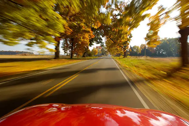 Driving down a country road in Autumn.