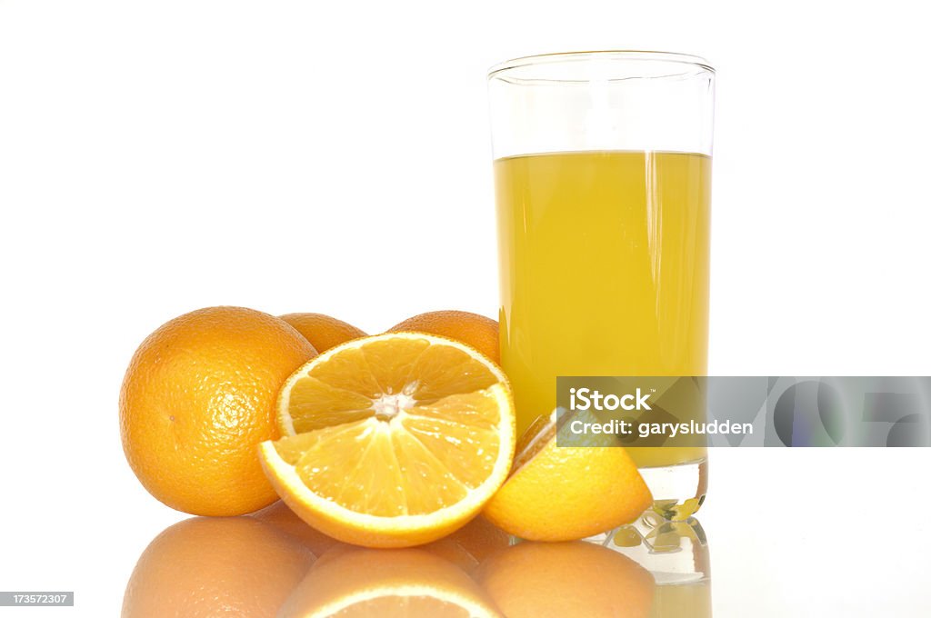 oranges and orange juice oranges and orange juice against a white background Brightly Lit Stock Photo