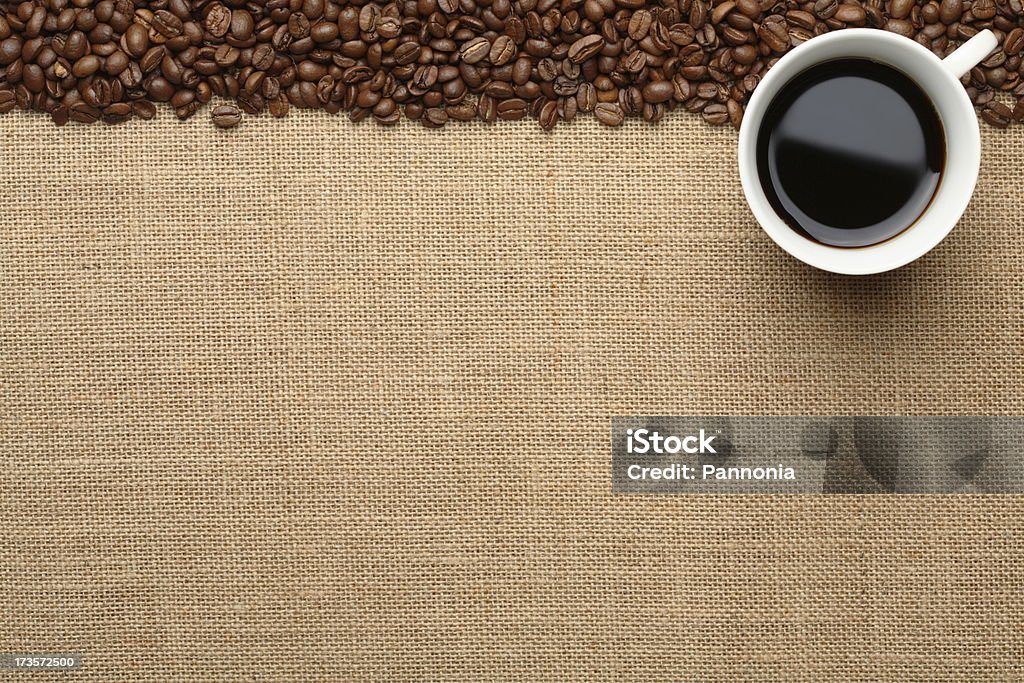 Coffee Background Coffee with coffee beans on burlap Coffee Cup Stock Photo