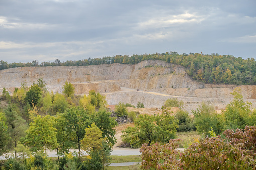 Extensive opencast mines near Beroun With mountains of sand in autumn weather. Czech. High quality photo
