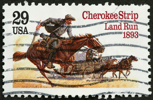 USA vintage postage stamp C M Russel, showing cowboys in the wild west lassoing cattle