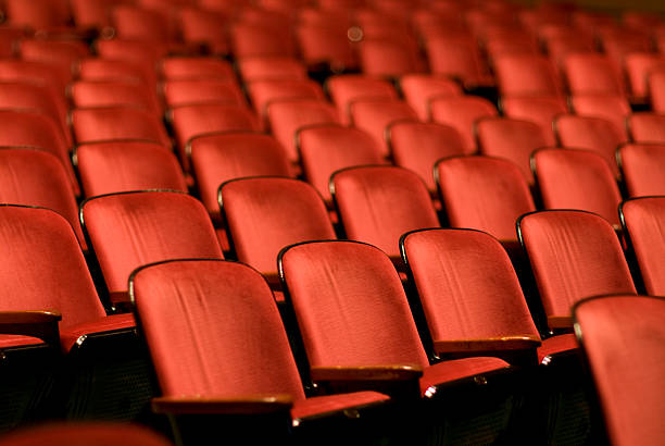 Theater Seats in an empty auditorium Empty Theater. stage theater stock pictures, royalty-free photos & images