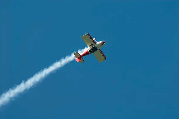 Acrobatic airplane with smoke trail