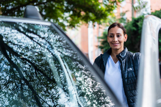 istock Doctor is using her car after finishing her shift at the hospital 1735749869