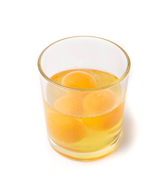 istock Broken Egg in Glass Isolated, Raw Yolk and White, Cracked Brown Shell, Fresh Broken Organic Chicken Eggs 1735750458
