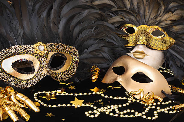 Set of golden mardi grass masks with feathers stock photo