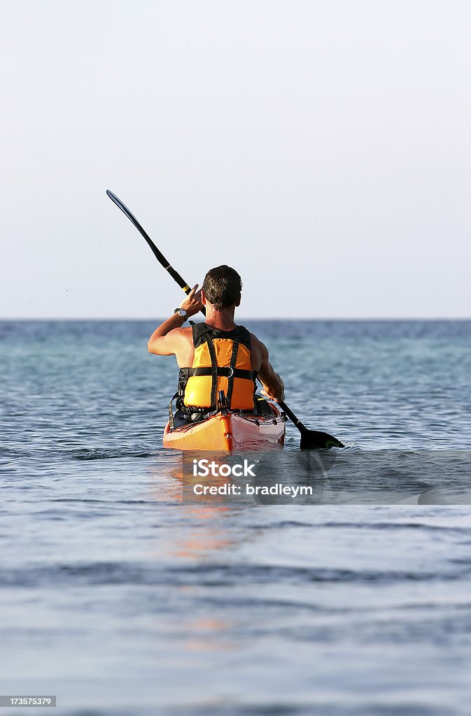 Out to sea A sea kayaker going away. Activity Stock Photo