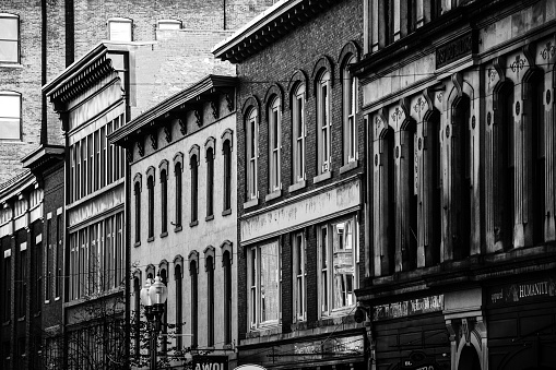 Lowell, Massachusetts - Old brick buildings facades on main street.