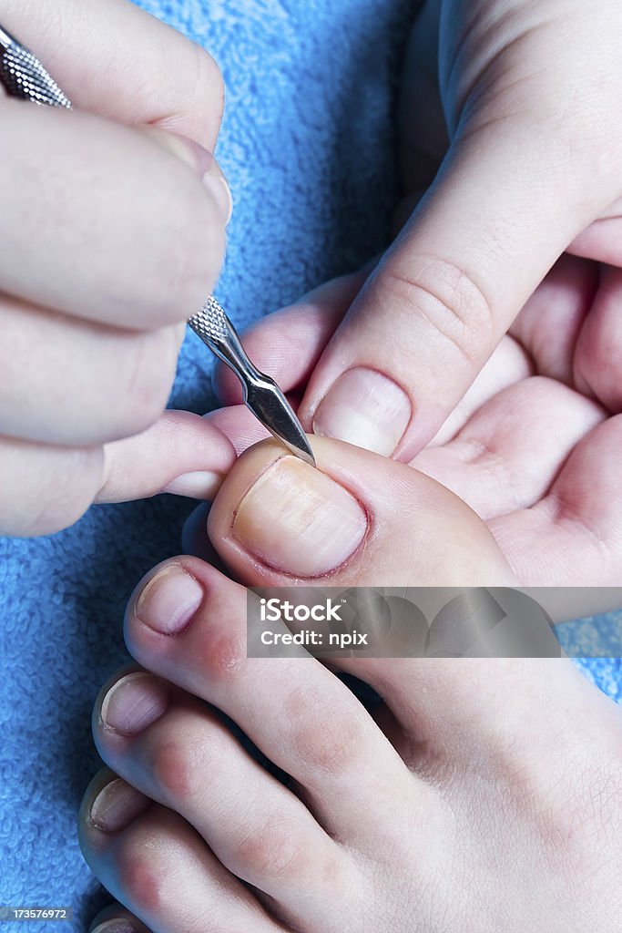 Cleaning of a foot. "Cleaning of a foot, pleasant and useful procedure." Human Foot Stock Photo