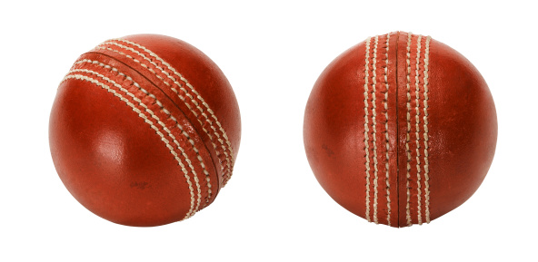 Red leather cricket ball from two views. Isolated on white.