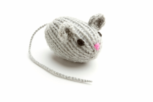 Little gray knitted mouse with shadow