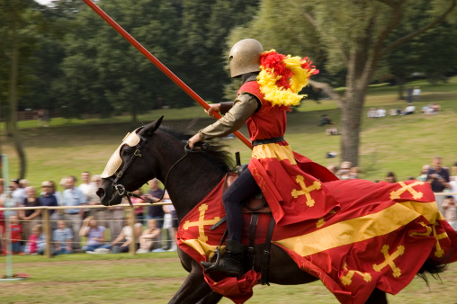 Kenilworth  England  July  29  2023  a knight   and  his  horses enter the  arena  in front  of  waiting  crowd