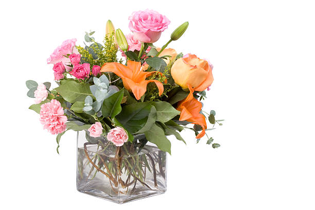 glass vase with bouquet of beautiful fresh flowers against white background