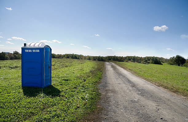 Roadside toilet portable toilet on deserted dirt road.Please Also See: portable toilet stock pictures, royalty-free photos & images