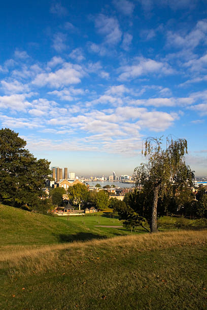 The view towards Woolwich Looking down the River Thames from Greenwich to Woolwich, where a thick brown fog hangs over the skyline. thames valley stock pictures, royalty-free photos & images