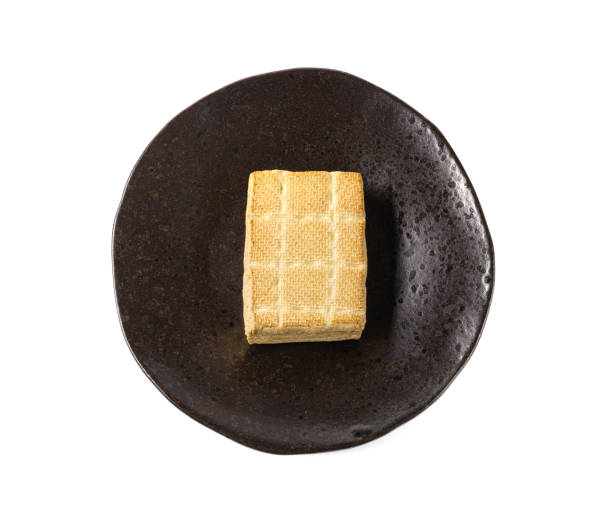 Tofu Cheese Isolated, Smoked Vegan Cheese Slice, Sliced Soya Bean Curd, Soy Protein or TSP Tofu Cheese Block Isolated, Smoked Vegan Cheese Slice on Plate, Sliced Soya Bean Curd, Soy Protein or TSP Healthy Meat Analogue, Tofu Cheese on White Background tsp stock pictures, royalty-free photos & images