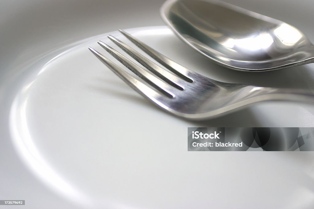 Tableware on Plate Close up shot of a spoon and fork on a plate.Similar images - Breakfast Stock Photo