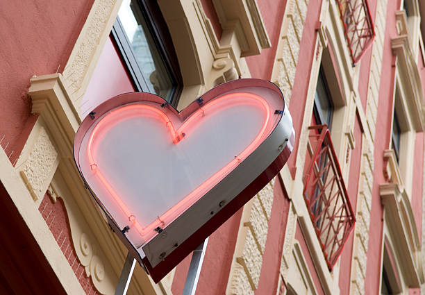 Love for Rent Neon heart in the red light district strip club stock pictures, royalty-free photos & images