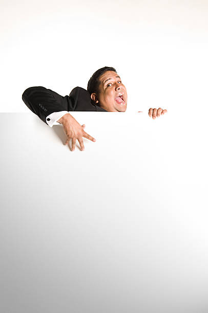 istock businessman with a sign 173580151