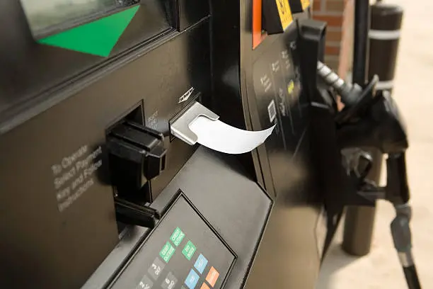 Photo of Receipt dispensing from gas pump machine