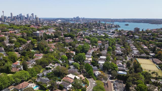 Aerial drone descending view above the harbourside suburb of Double Bay in east Sydney, NSW looking toward Sydney Harbour and Sydney City