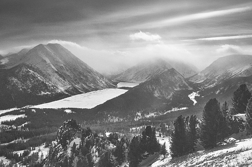 Snow-covered winter mountain lake, Russia, Siberia, Altai mountains. Multinskie lakes.