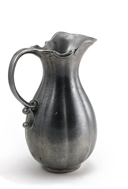 istock Antique pewter water pitcher isolated on white 173583142