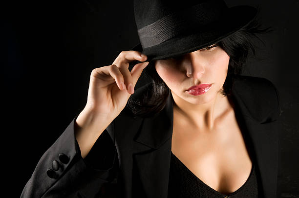 istock Beautiful woman in black with black hat 173583205