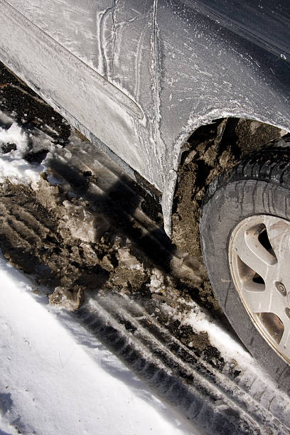car with slush, snow and salt stock photo