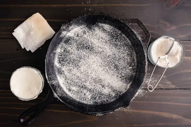 Frying pan coated with vegetable oil and dusted with all-purpose flour to prevent sticking