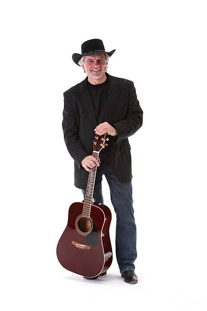 istock Singing cowboy standing with guitar 173583538