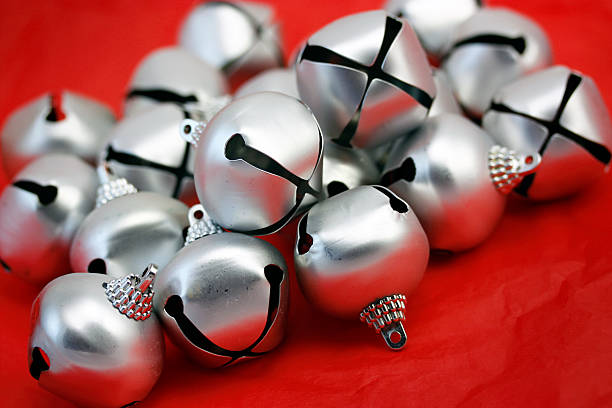istock Christmas bell ornaments in a pile on red 173583691