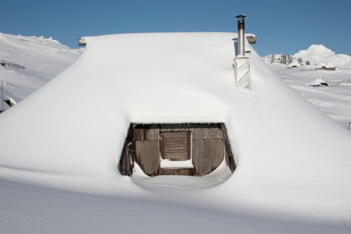 Hut covered with snow