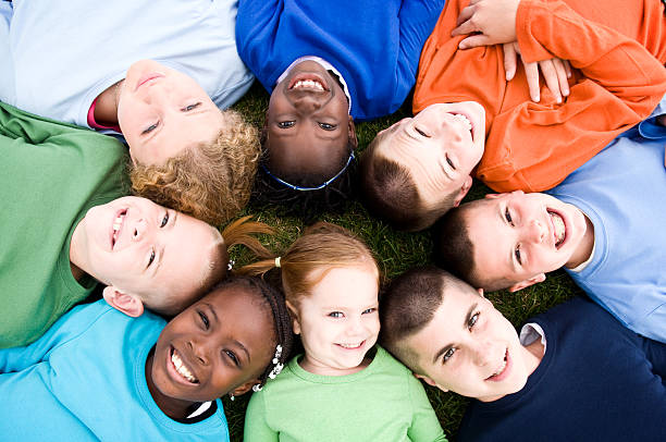 istock Happy Group of Kids Lying in a Circle 173584408