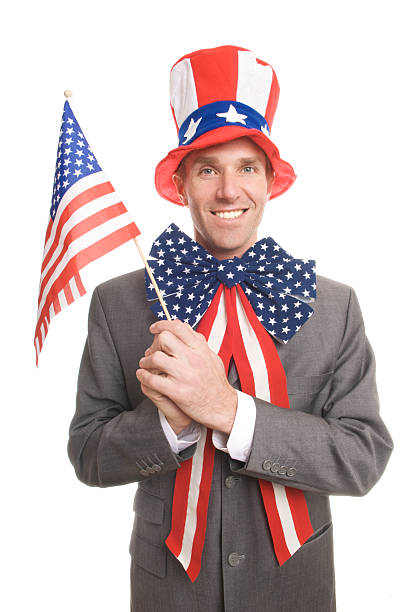 istock Smiling Guy Stands at White Background w American Flags 173584804